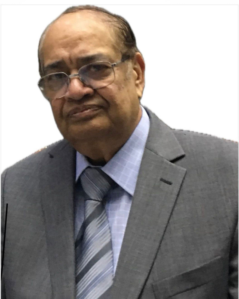 Man in gray suit with striped tie and glasses