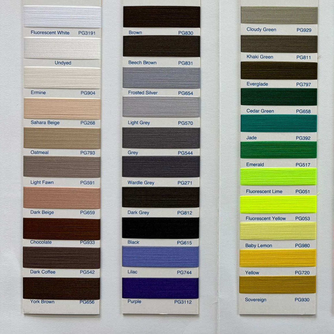 Colorful fabric trimmings swatch with labeled shades for garment and upholstery use