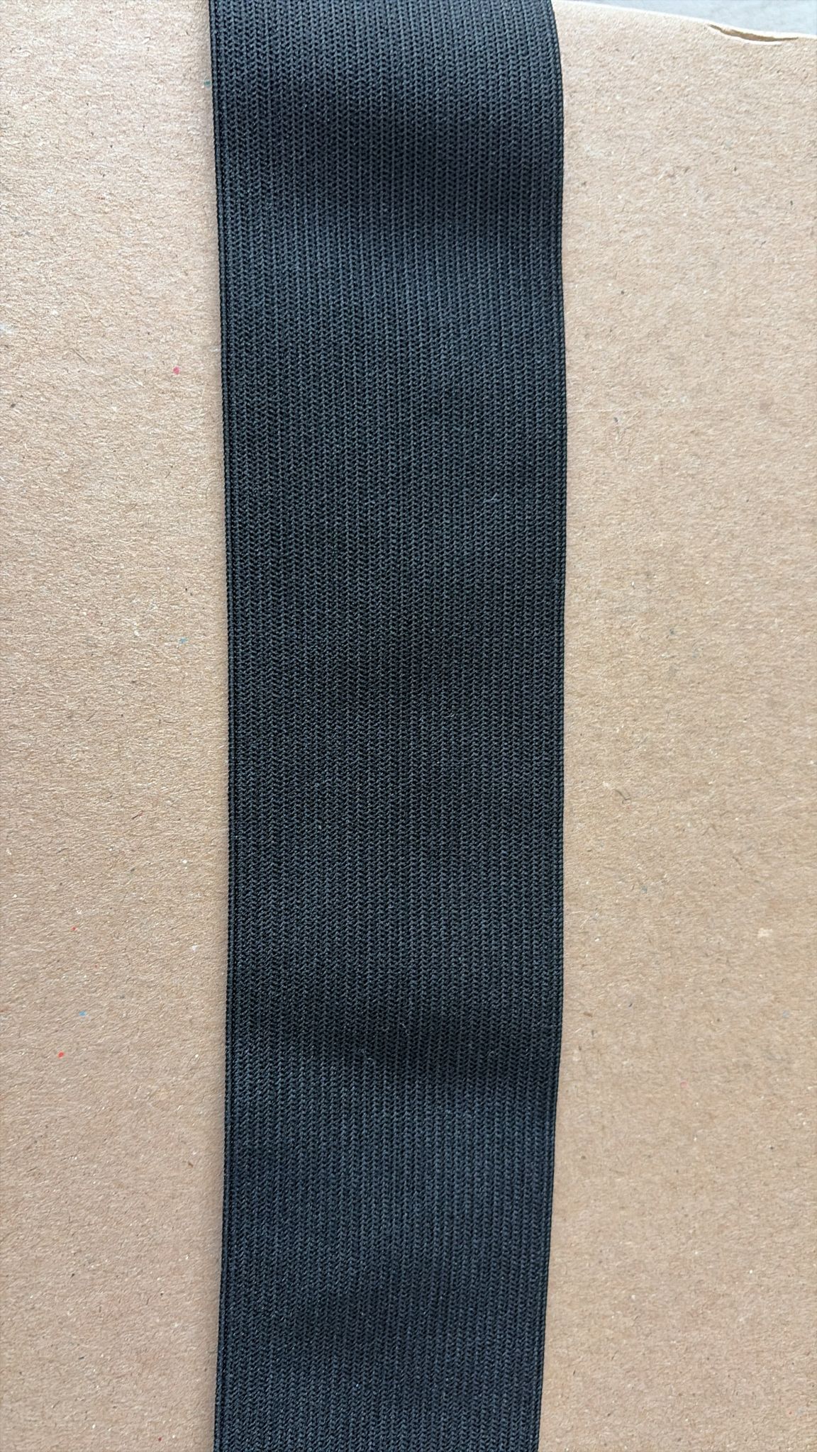 Black knitted elastic trim for garment and upholstery use