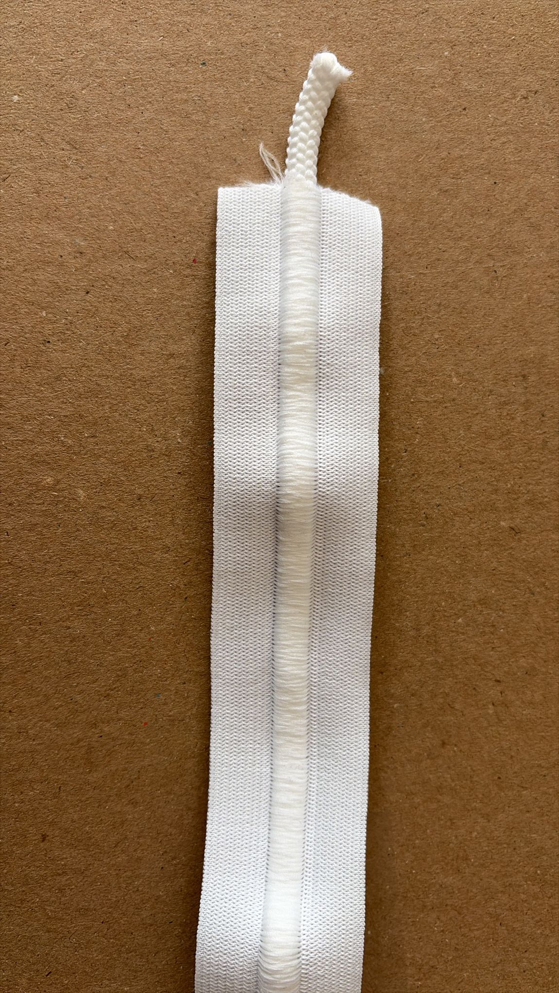 White fabric trim with braided edge for garment and upholstery use