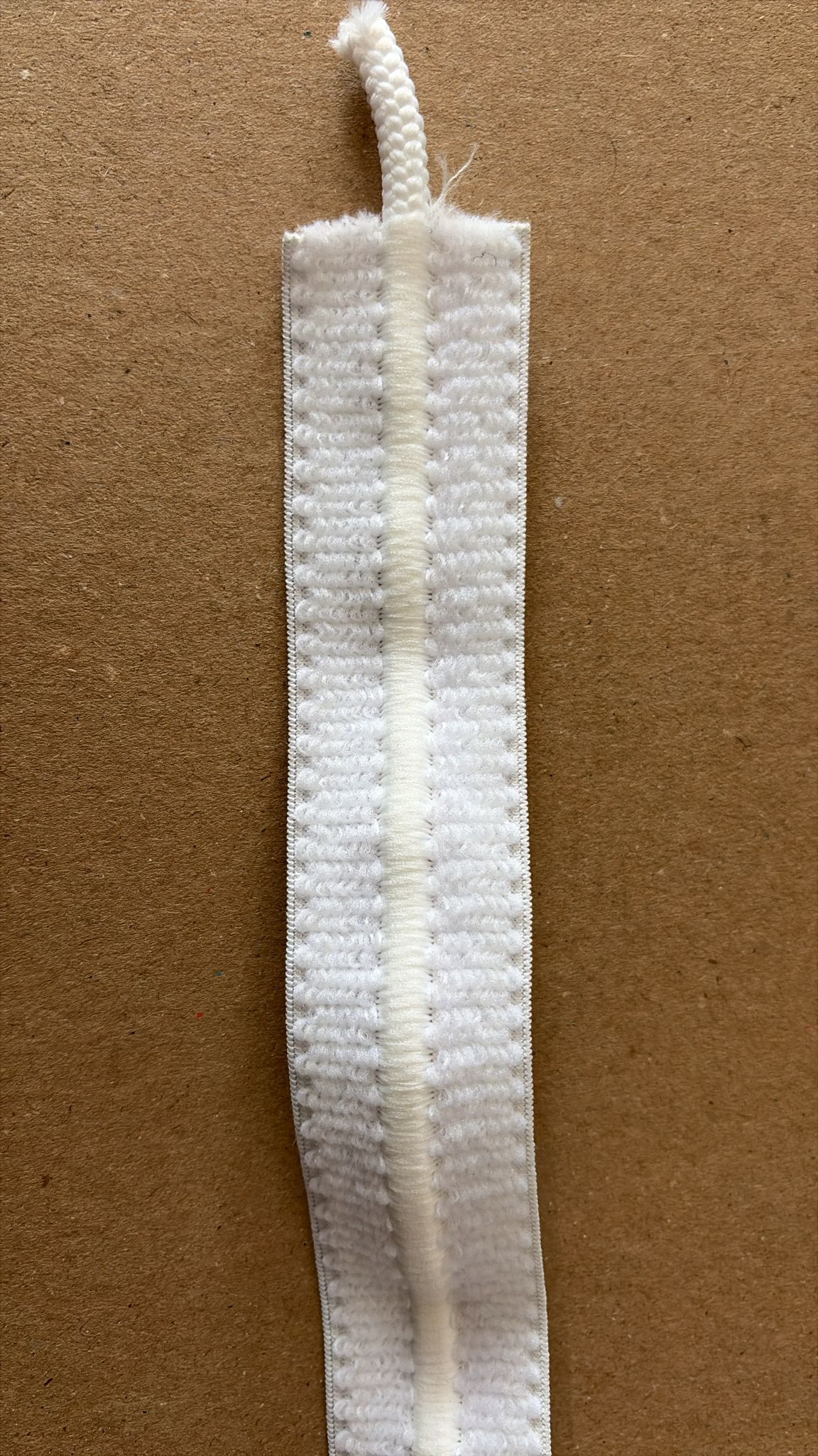 White textured fabric trim with braided edge for garment and upholstery use