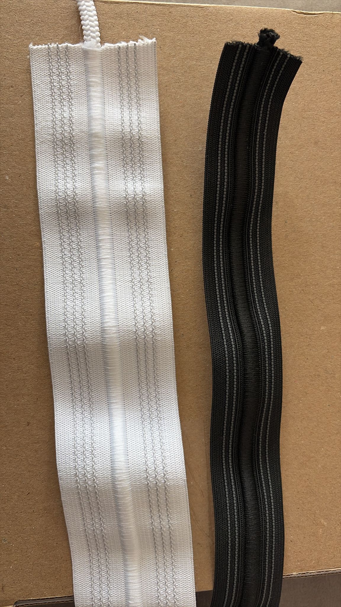 White and black elastic trim with ribbed texture for garment and upholstery use