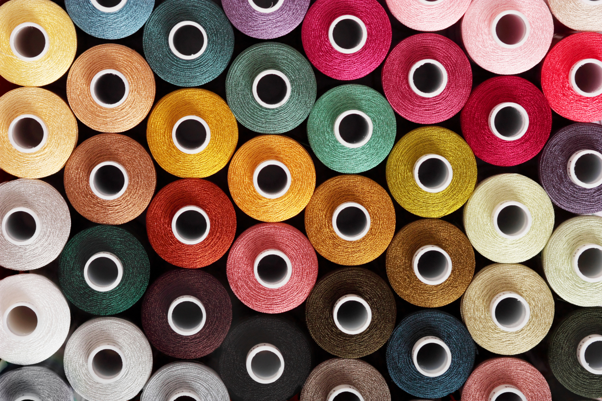 Colorful spools of thread for garment and upholstery sewing projects